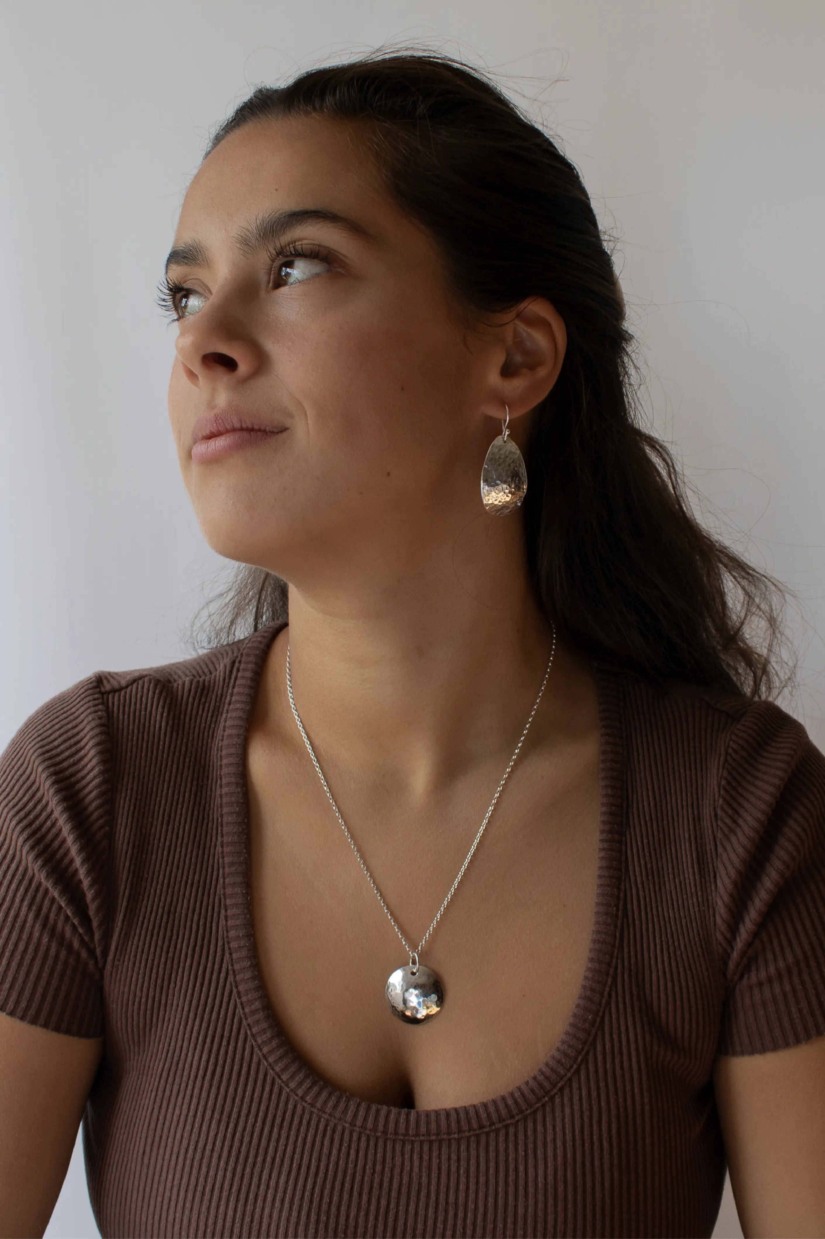 Another shot of the model wearing the discotheque earrings and necklace.