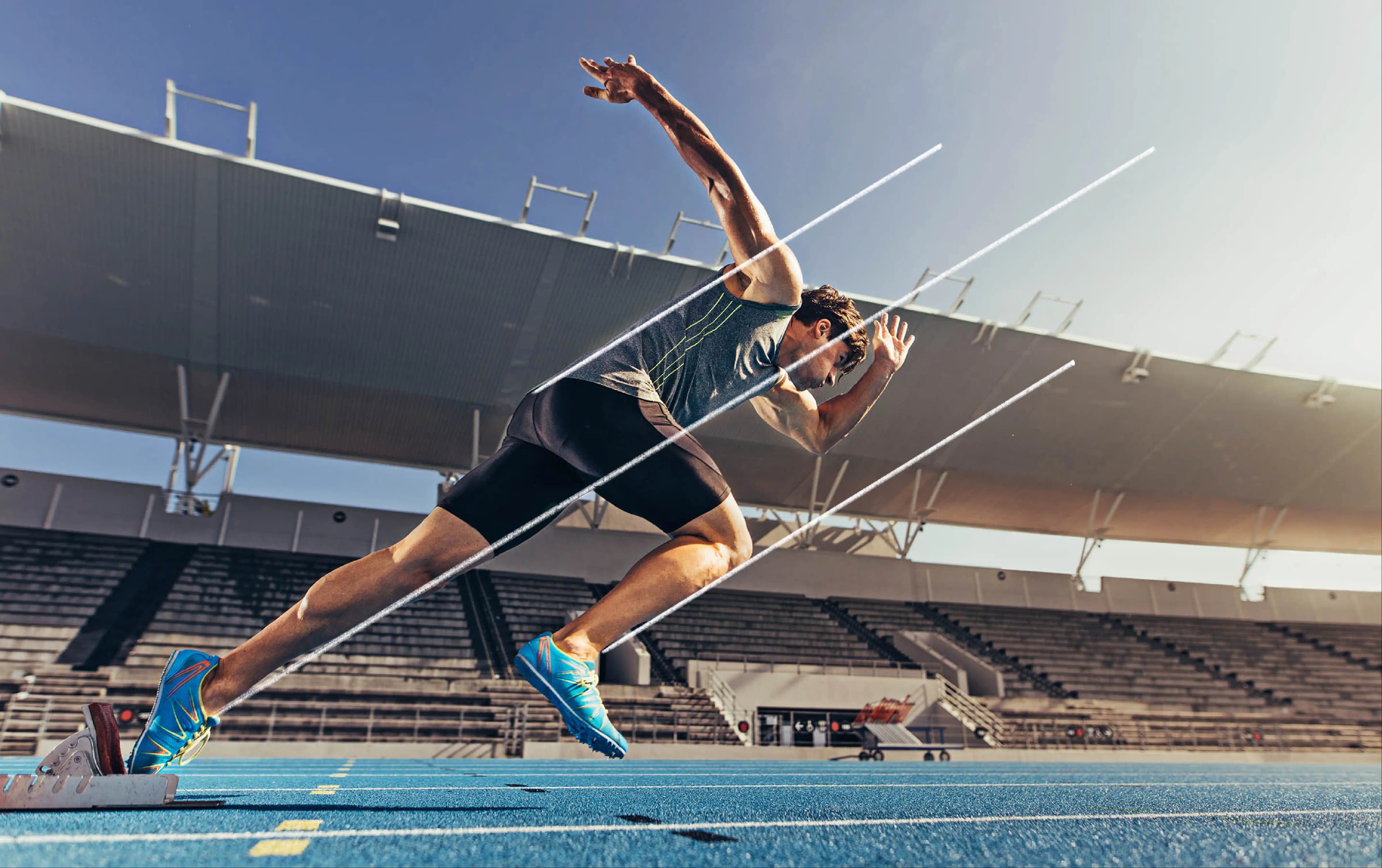 athlete setting of for a sprint run on a running track.